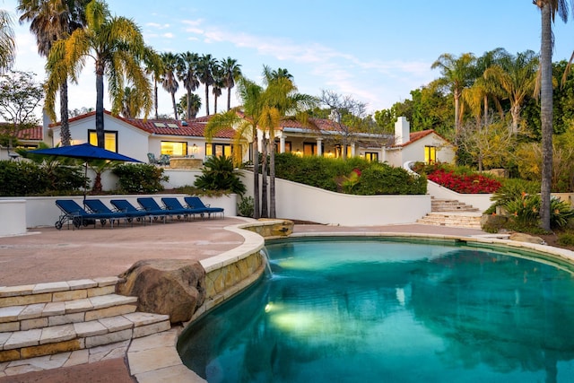 outdoor pool with a patio