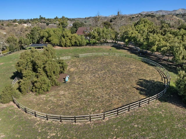 aerial view featuring a rural view and a mountain view