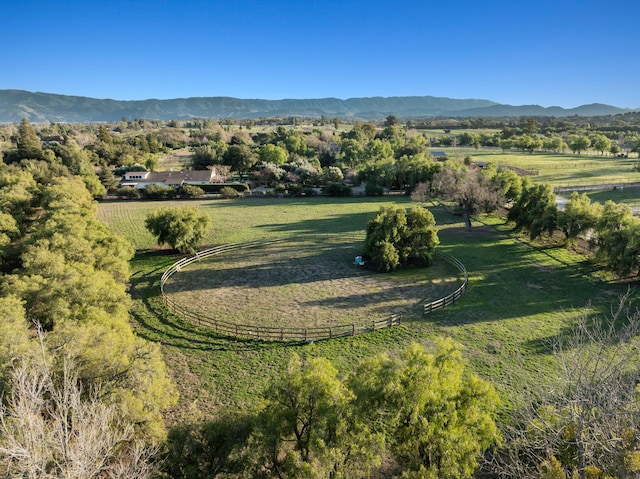 drone / aerial view with a mountain view and a rural view