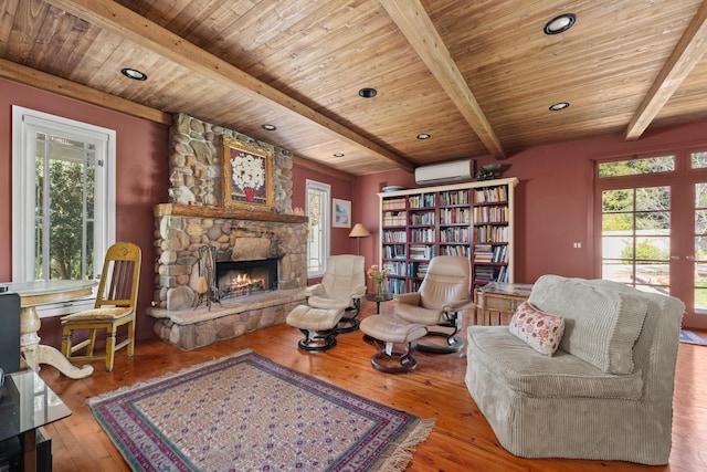 living room featuring a stone fireplace, wood ceiling, and wood-type flooring