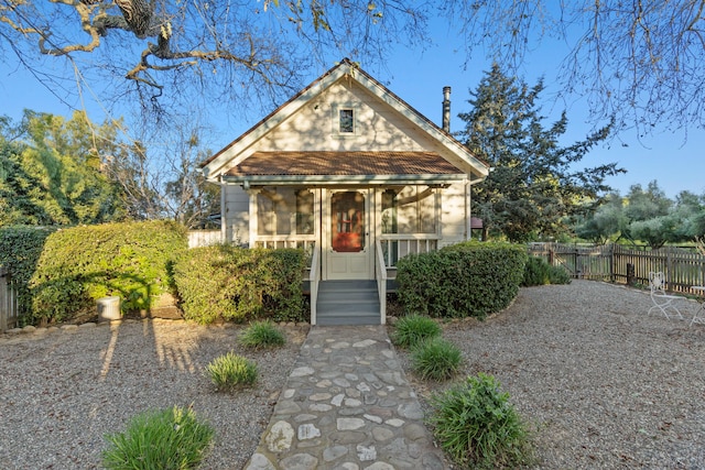 view of front of property featuring fence