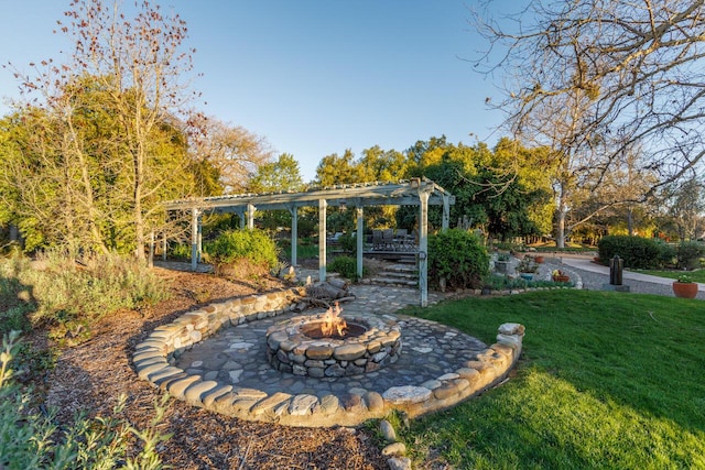 view of yard with a patio, an outdoor fire pit, and a pergola