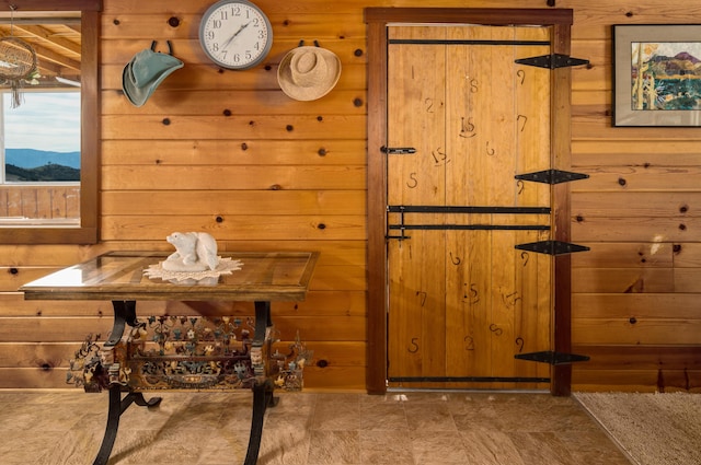 interior space featuring wood walls and a mountain view