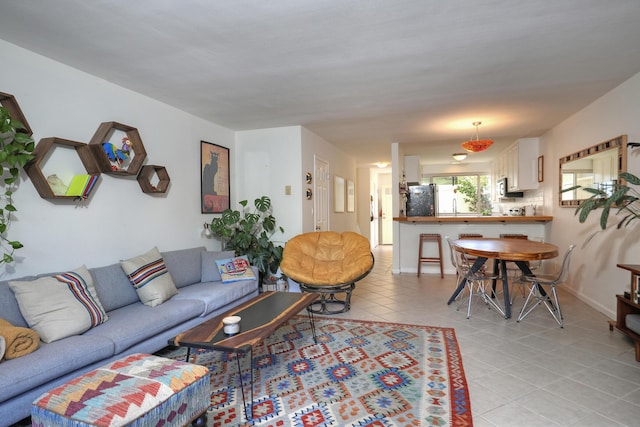 living room with light tile patterned flooring