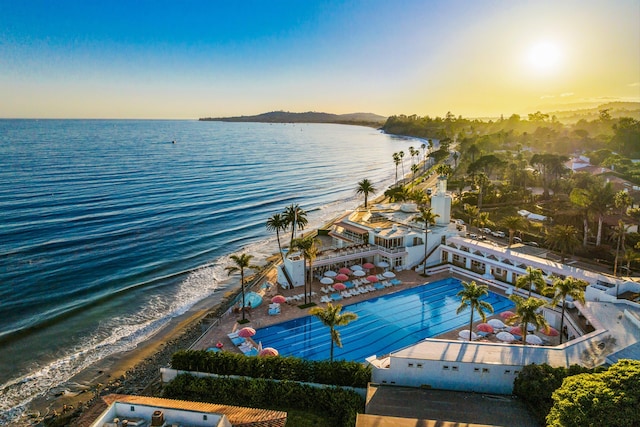 birds eye view of property featuring a water view and a view of the beach