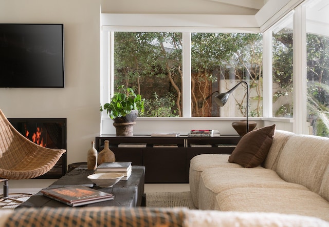 living room with a warm lit fireplace