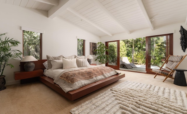 bedroom with carpet floors, access to exterior, and vaulted ceiling with beams