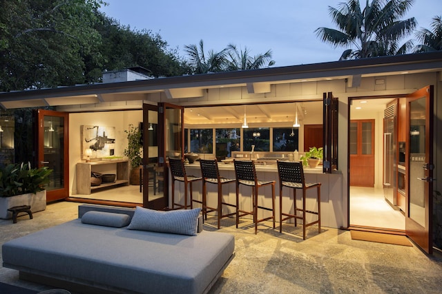 view of patio featuring an outdoor living space and outdoor dry bar