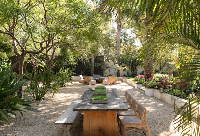 view of patio / terrace with a fire pit and fence