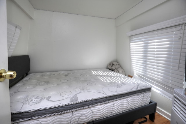 bedroom with wood finished floors