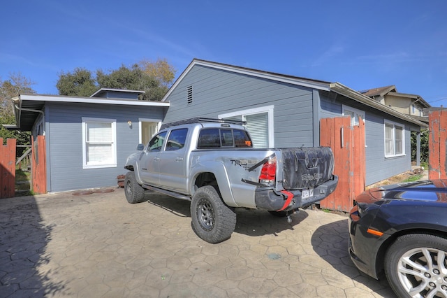 view of side of property with an outbuilding