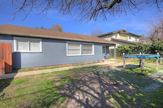 view of side of home with fence