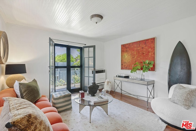 living room with wood finished floors and french doors