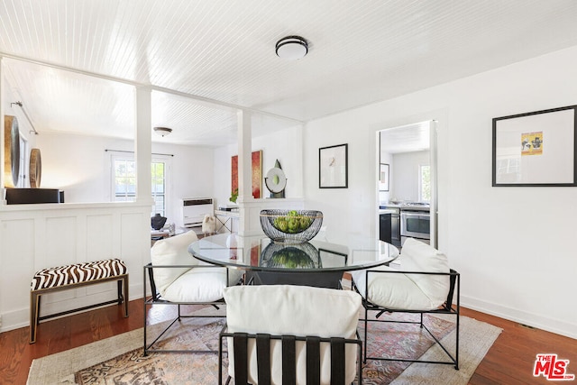 dining room with baseboards and wood finished floors