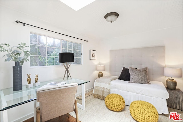 bedroom featuring baseboards