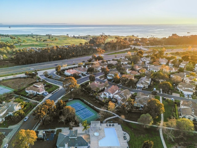 drone / aerial view featuring a water view and a residential view