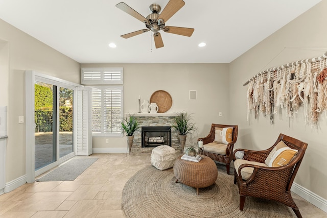 living area with visible vents, recessed lighting, a fireplace, and baseboards