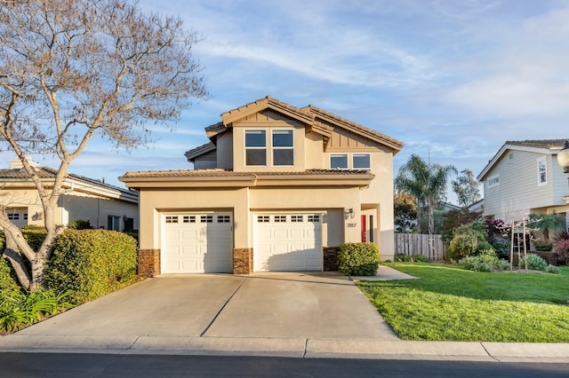 view of front of property featuring stucco siding, fence, concrete driveway, an attached garage, and a front yard