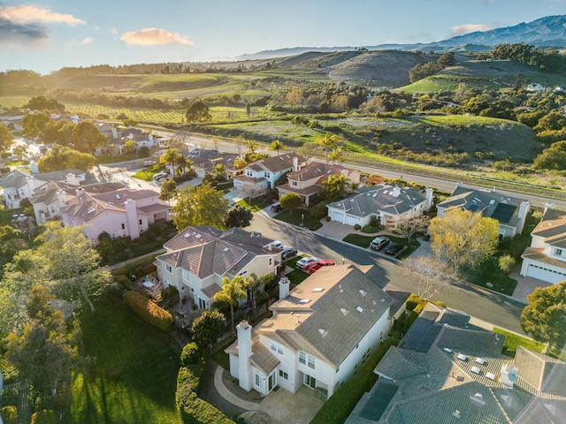 birds eye view of property featuring a mountain view and a residential view