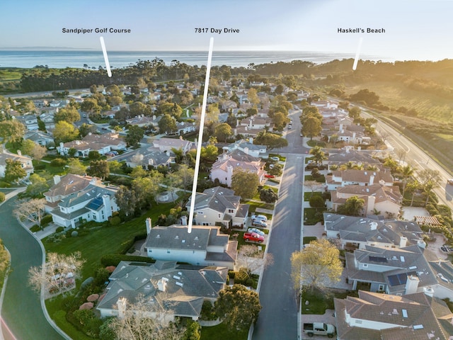 drone / aerial view with a residential view and a water view