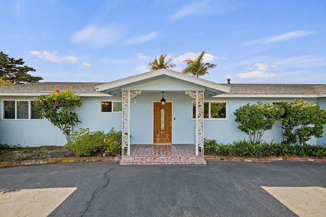 ranch-style house with stucco siding