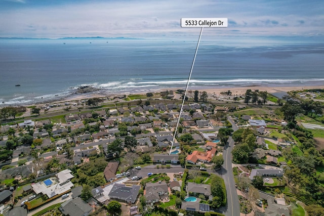 birds eye view of property with a residential view, a beach view, and a water view