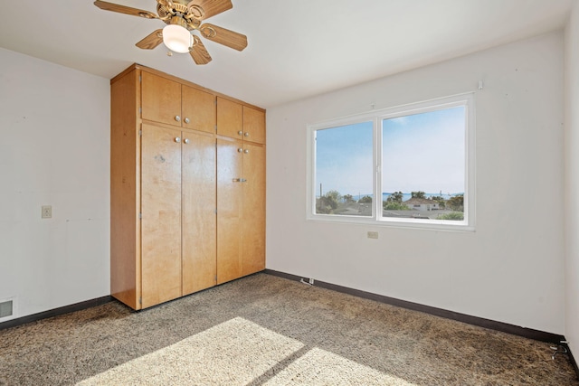 unfurnished bedroom featuring visible vents, baseboards, a closet, and ceiling fan