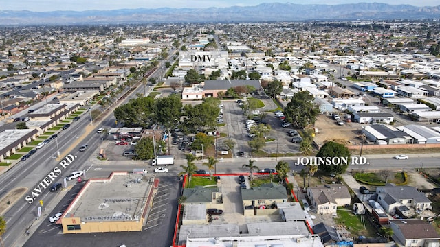 drone / aerial view with a residential view and a mountain view