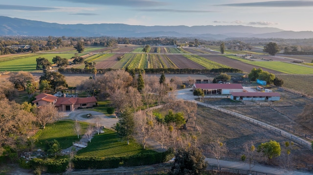 drone / aerial view featuring a mountain view and a rural view