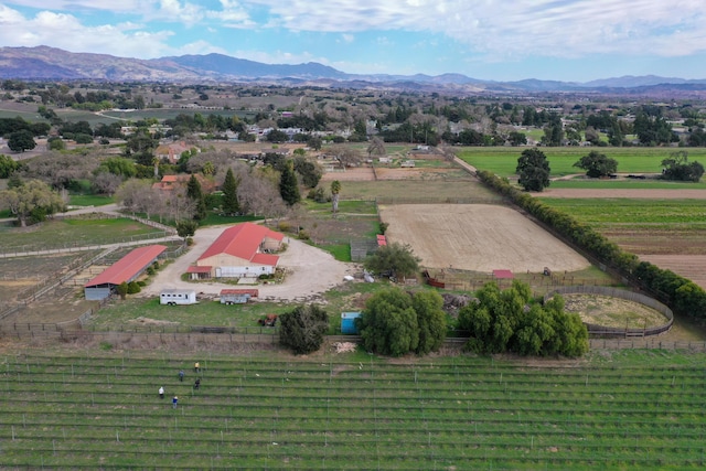 birds eye view of property with a mountain view and a rural view