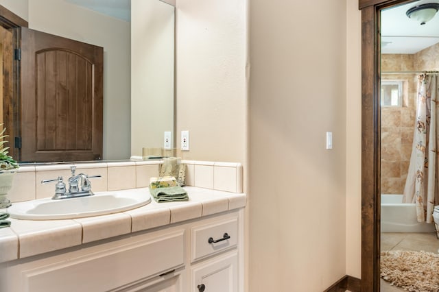 full bathroom with tile patterned floors, vanity, and shower / bathtub combination with curtain