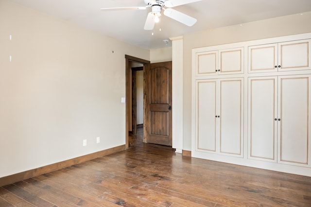 unfurnished bedroom featuring wood-type flooring, baseboards, and a ceiling fan