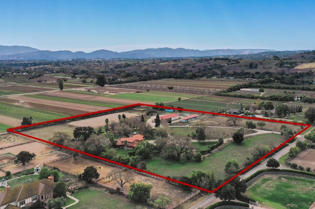 aerial view featuring a rural view and a mountain view