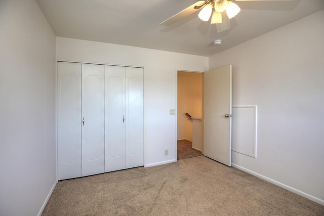 unfurnished bedroom with a ceiling fan, baseboards, a closet, and carpet floors