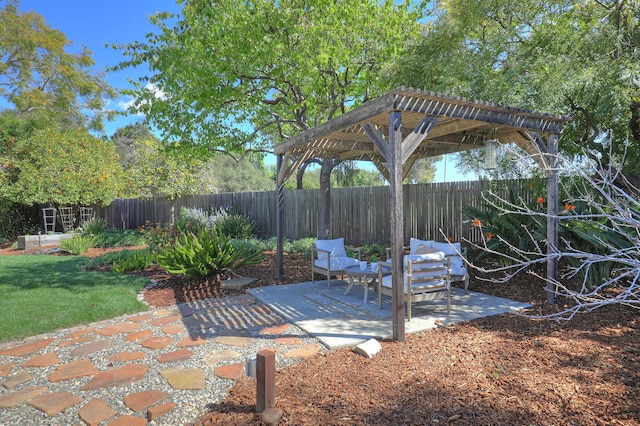 view of patio / terrace featuring a pergola and a fenced backyard