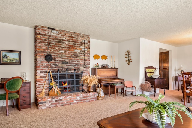 living area with carpet floors, a brick fireplace, and a textured ceiling