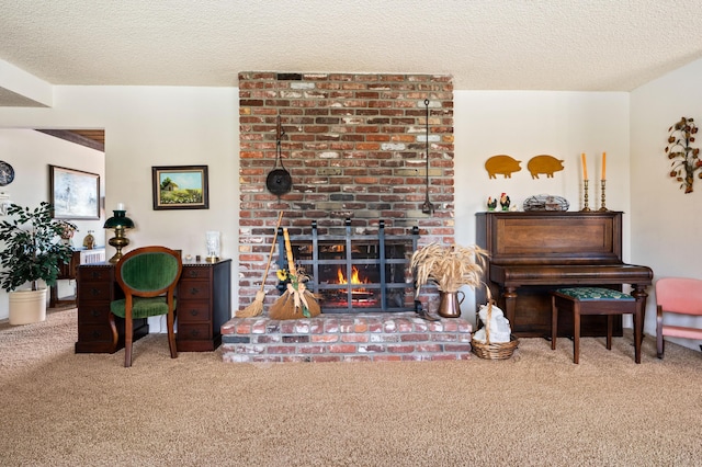 carpeted living room featuring a fireplace and a textured ceiling