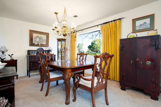 dining space with a chandelier, visible vents, light carpet, and a textured ceiling