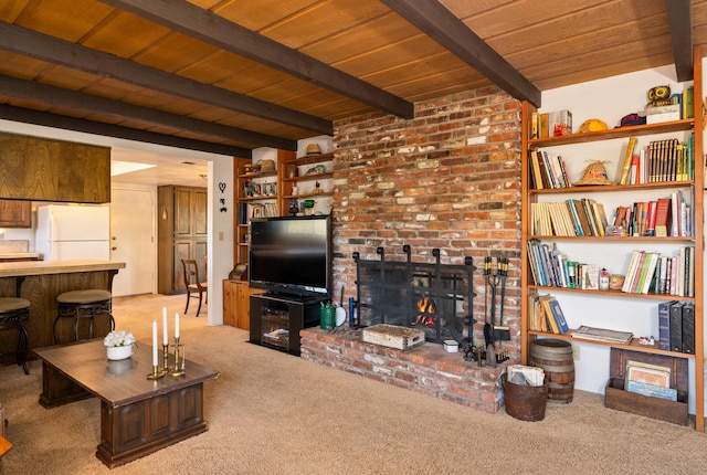 carpeted living area with beamed ceiling, wooden ceiling, and a brick fireplace