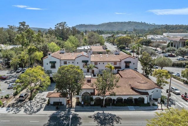 birds eye view of property with a mountain view