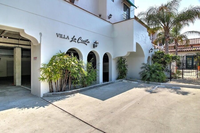 exterior space featuring fence and stucco siding