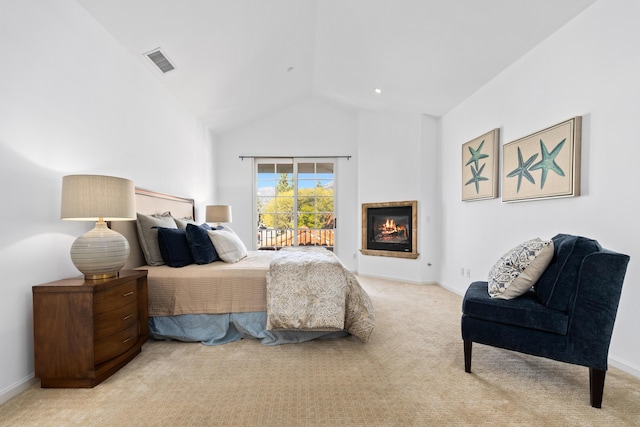 bedroom featuring light carpet, visible vents, baseboards, access to exterior, and a glass covered fireplace