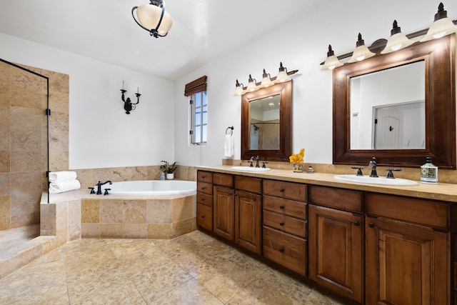 full bathroom featuring a garden tub, double vanity, a sink, and a tile shower