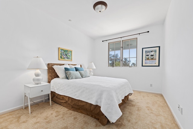 bedroom with carpet and baseboards