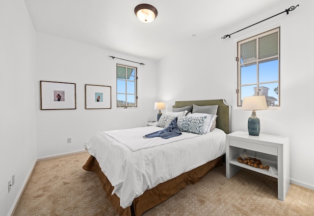 bedroom featuring carpet floors and baseboards