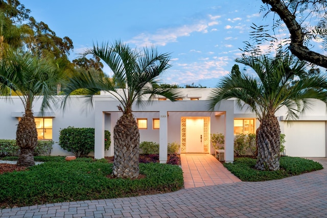 view of front of house featuring stucco siding