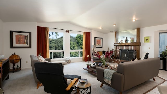 living area featuring vaulted ceiling, a fireplace, visible vents, and carpet floors