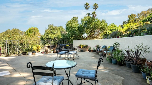 view of patio / terrace featuring fence