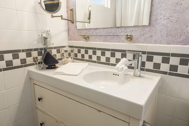 bathroom with tile walls and vanity