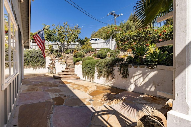 view of patio / terrace featuring fence